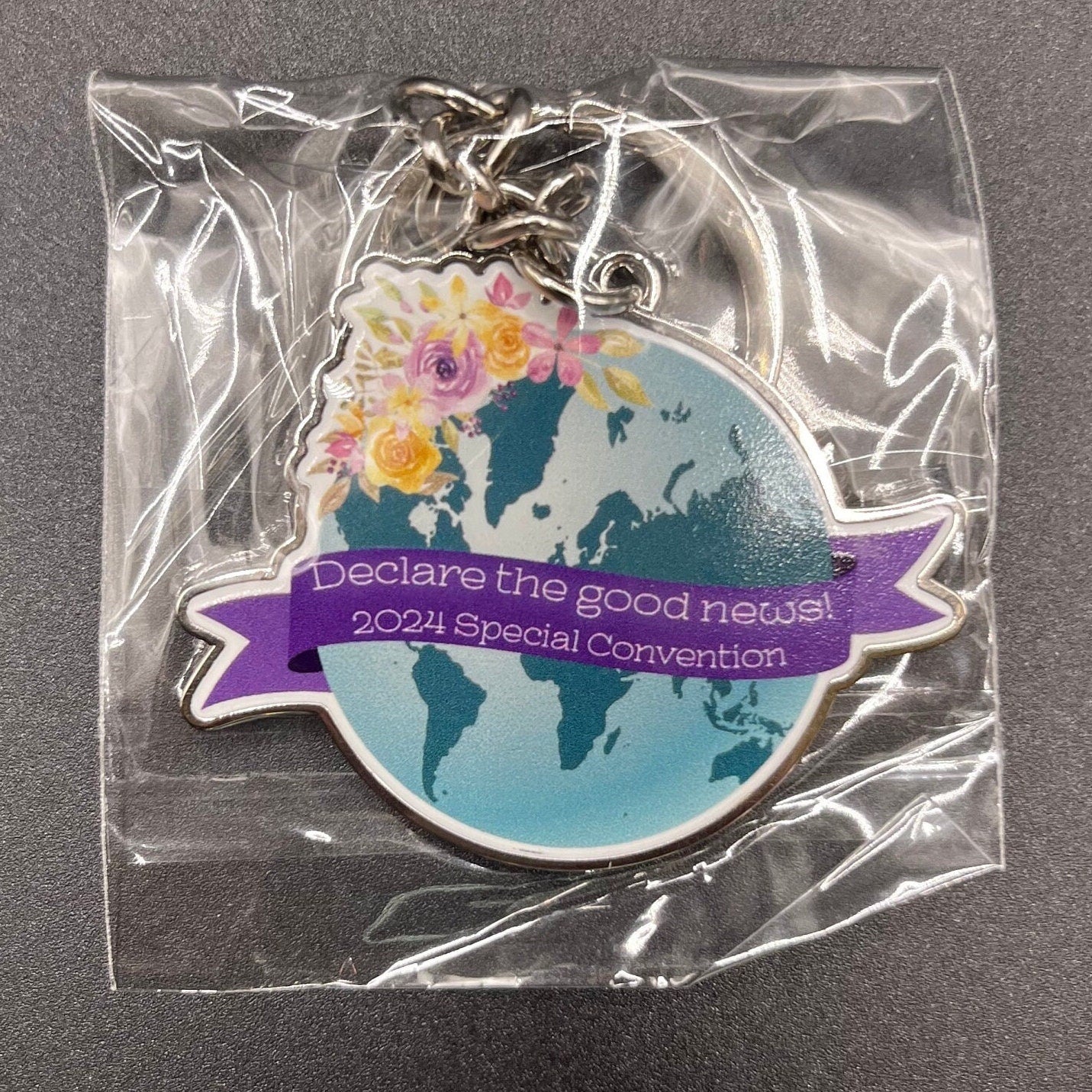 Declare the Good News 2024 Special Convention Floral Globe Keychain and Lapel Pin