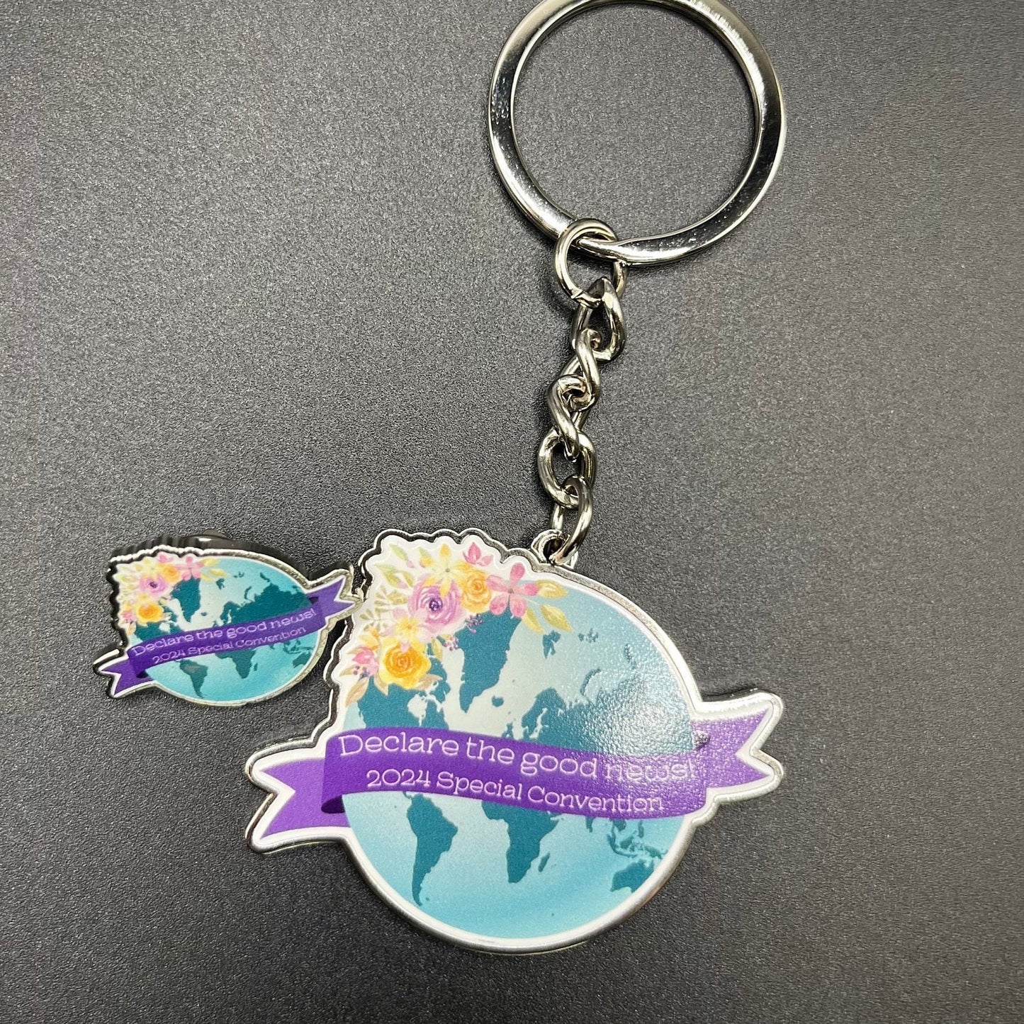 Declare the Good News 2024 Special Convention Floral Globe Keychain and Lapel Pin